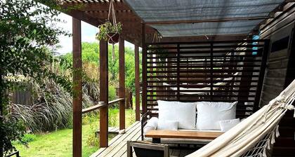 Cozy studio DUNA in La Pedrera with AC, WiFi, front deck on a garden