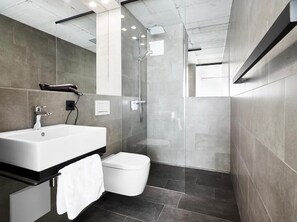 Shower, hair dryer, towels, soap