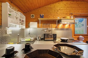 Fridge, microwave, stovetop, coffee/tea maker