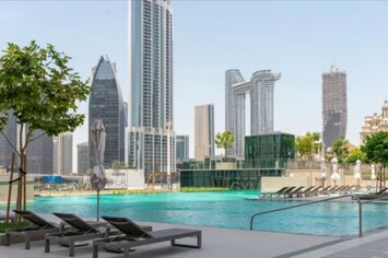 Take a dip in the luxurious pool with panoramic views of the iconic Dubai skyline.