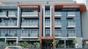 A modern building with a sign reading "PARK VISTA". It features multiple balconies and large windows. - Stylish Sanctuary Studio with Pool view (Dubai)