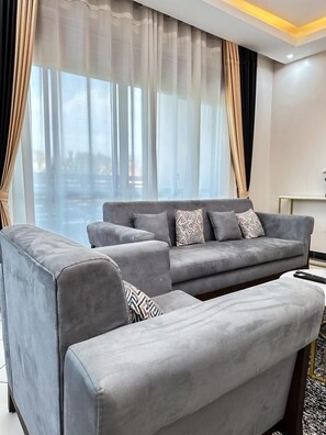 Comfort Apartment, City View | Living area | Flat-screen TV