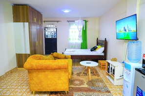 Business Studio Suite, City View | Living area | 24-inch Smart TV with digital channels - Lux Suites RFH Apartments Ruiru (Ruiru)