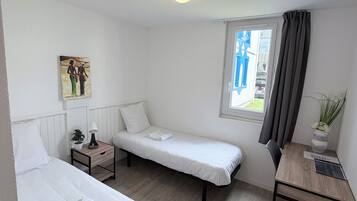 Twin kamer | Geluiddichte muren, beddengoed