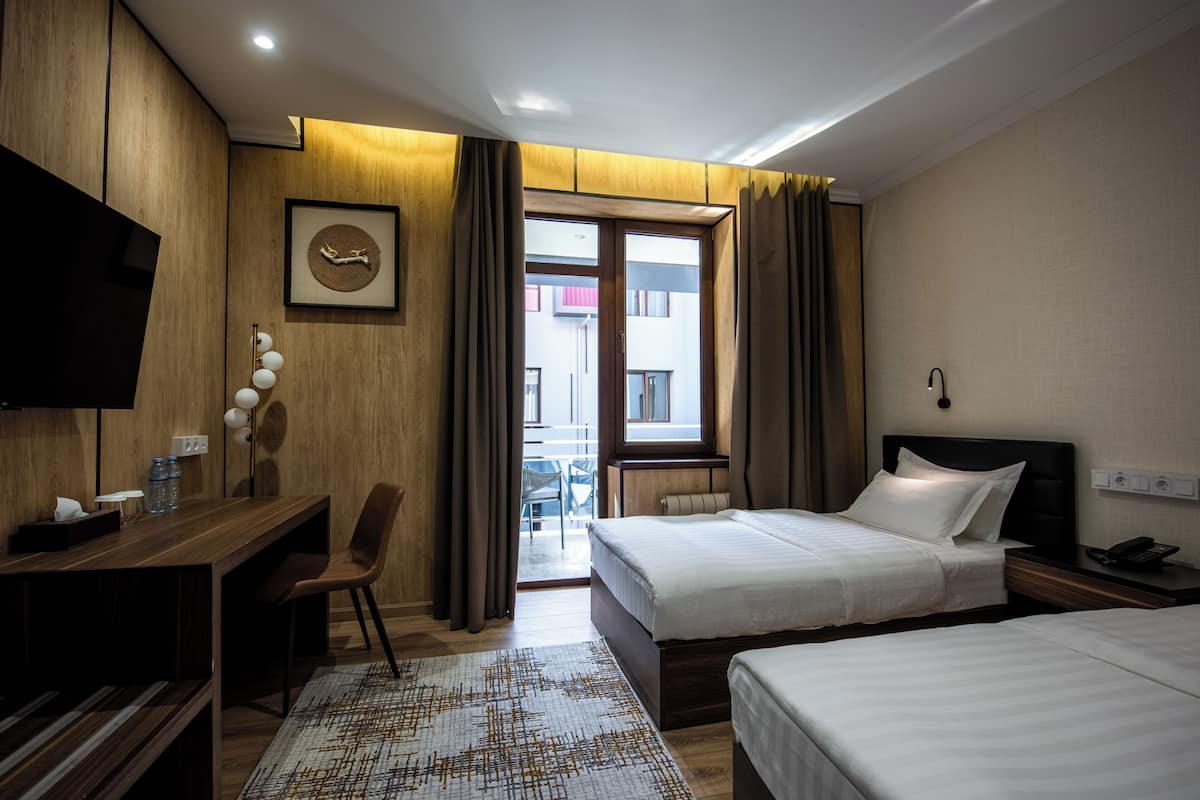 Luxe beddengoed, een kluis op de kamer, individueel gedecoreerd