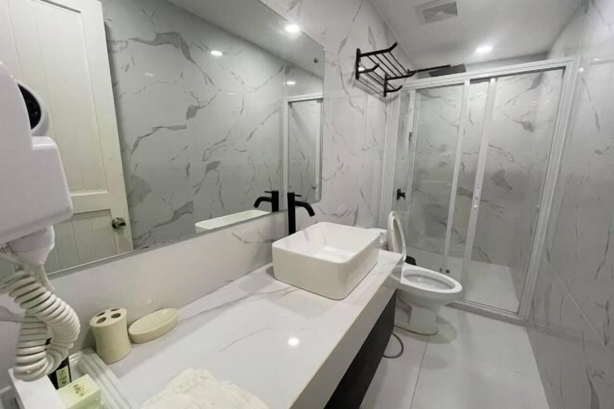 Bathroom | Free toiletries, slippers, towels, soap
