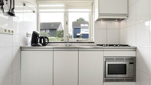 Fridge, stovetop, coffee/tea maker, electric kettle