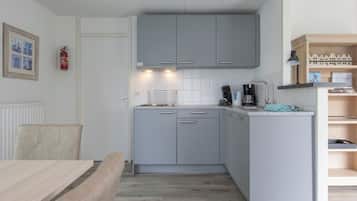 Fridge, stovetop, dishwasher, coffee/tea maker