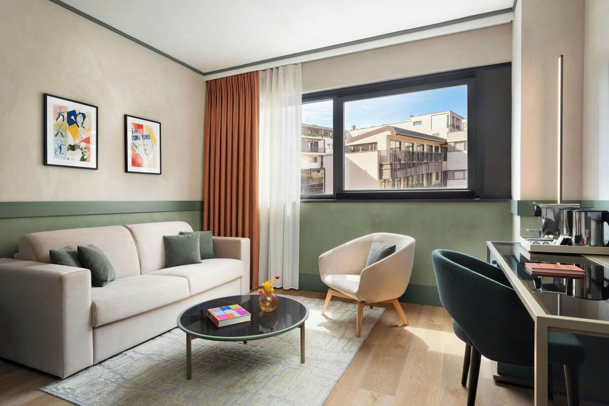 Suite, 1 King Bed with Sofa bed | Living area | Smart speakers