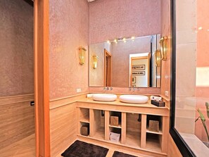 Shower, hair dryer, towels, toilet paper