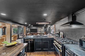 Fridge, microwave, oven, stovetop - Relax and unwind at The Whiskey Barrel, a cozy waterfront retreat designed for fun and laid-back lake living. Soak in your private hot tub, paddle out with the kayaks, or spend the afternoon on one of the 4 decks reading a good book (Karnack)