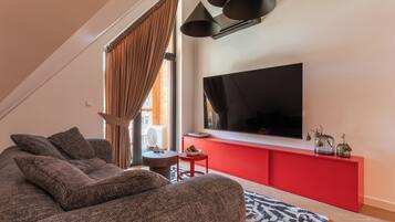 Superior Apartment | Living area | Flat-screen TV