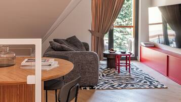 Superior Apartment | Living area | Flat-screen TV