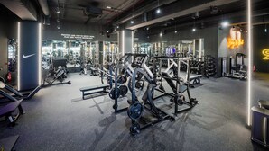 A gym with various exercise equipment, a large mirror, and motivational wall text. - Best View Fortina Luxury Suites  (Sliema)