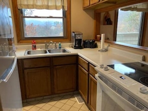 Enjoy cooking in this well-equipped kitchen with an oven, dishwasher, and coffee maker.