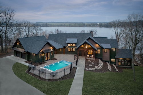 Private lakeside retreat with pool, hot tub, and sauna