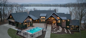 Private lakeside retreat with pool, hot tub, and sauna