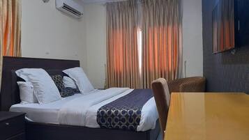 Deluxe Room, Balcony, City View | Desk, laptop workspace, free WiFi