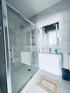 Shower, hair dryer, towels, soap