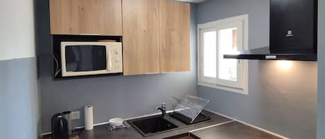 Fridge, microwave, stovetop, coffee/tea maker