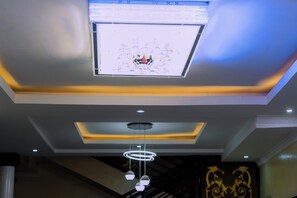 Deluxe Double Room, Balcony, City View | Living area | 42-inch Smart TV with cable channels, tablet, video-game console