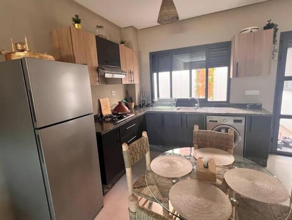 Fridge, oven, electric kettle, cookware/dishes/utensils