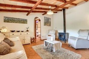 TV, fireplace - Can Monget by Rentallorca (Petra)