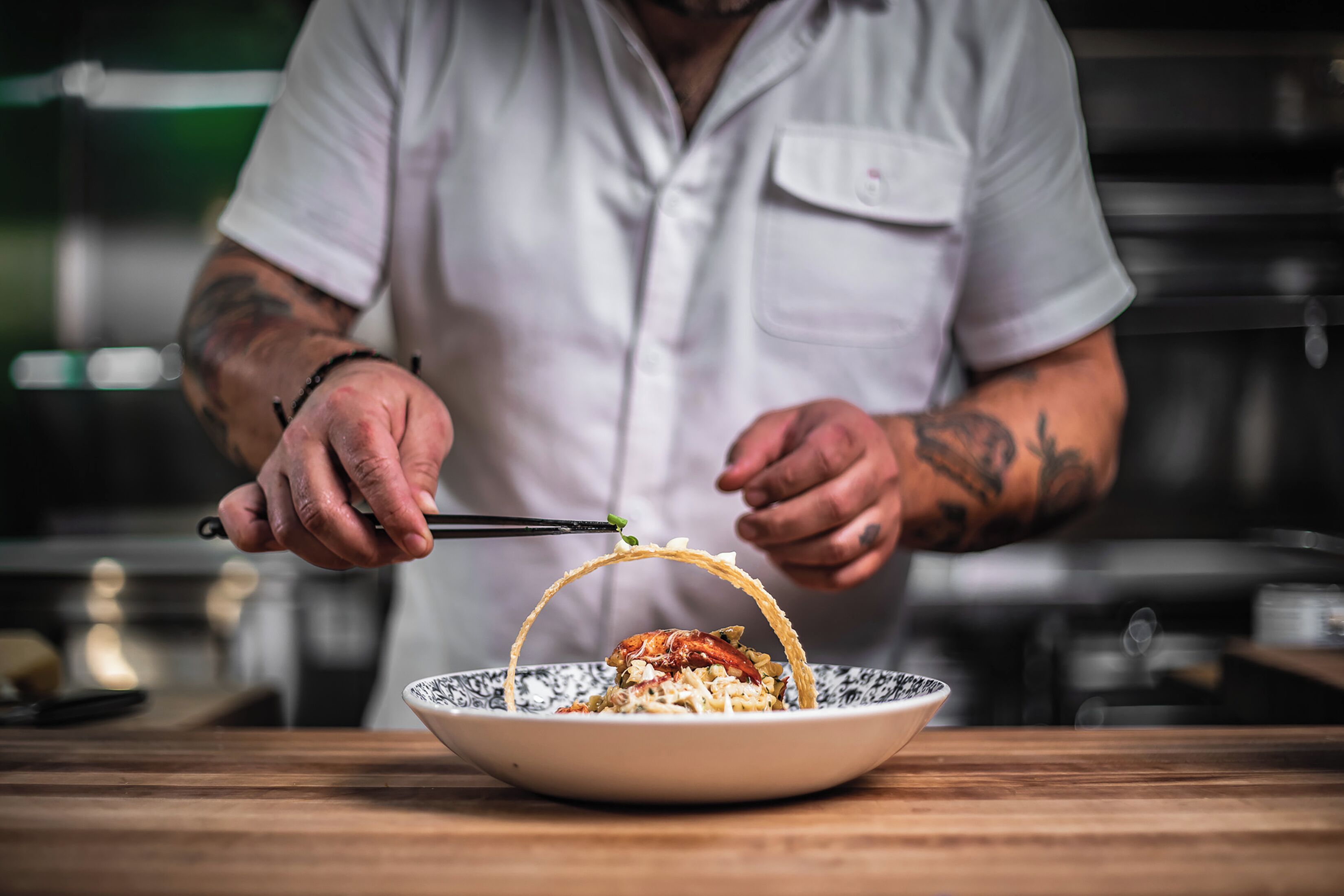 A person serving food from a bowl.