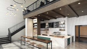 A modern bar area with a central island, bar stools, and a staircase leading to an upper level.