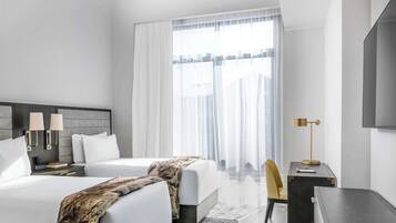 3 bedrooms, premium bedding, in-room safe, desk