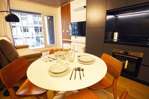 A modern kitchen with a dining area set for four. - "Your Temporary Home in Belgrano" (Ciudad Autónoma de Buenos Aires)