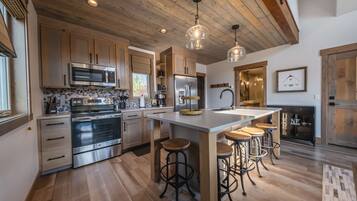 Microwave, dishwasher, coffee/tea maker, cookware/dishes/utensils