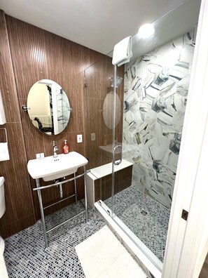 Shower, hair dryer, towels, toilet paper