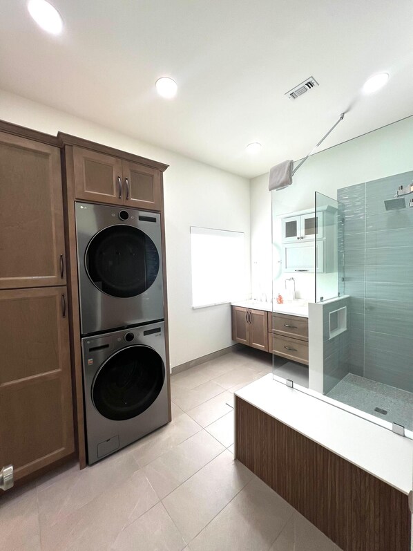 Shower, hair dryer, towels, toilet paper