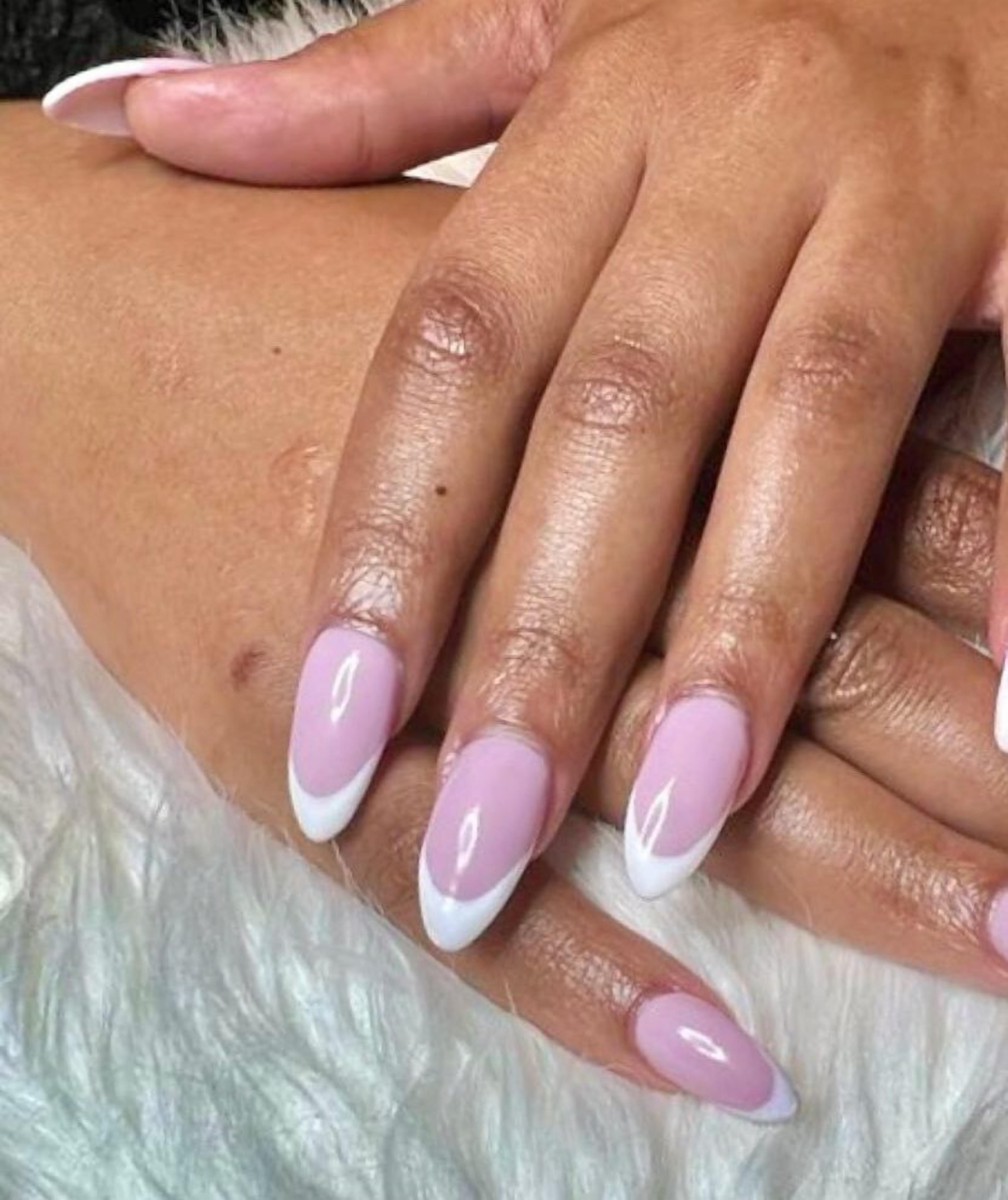 A close-up of hands with manicured nails.
