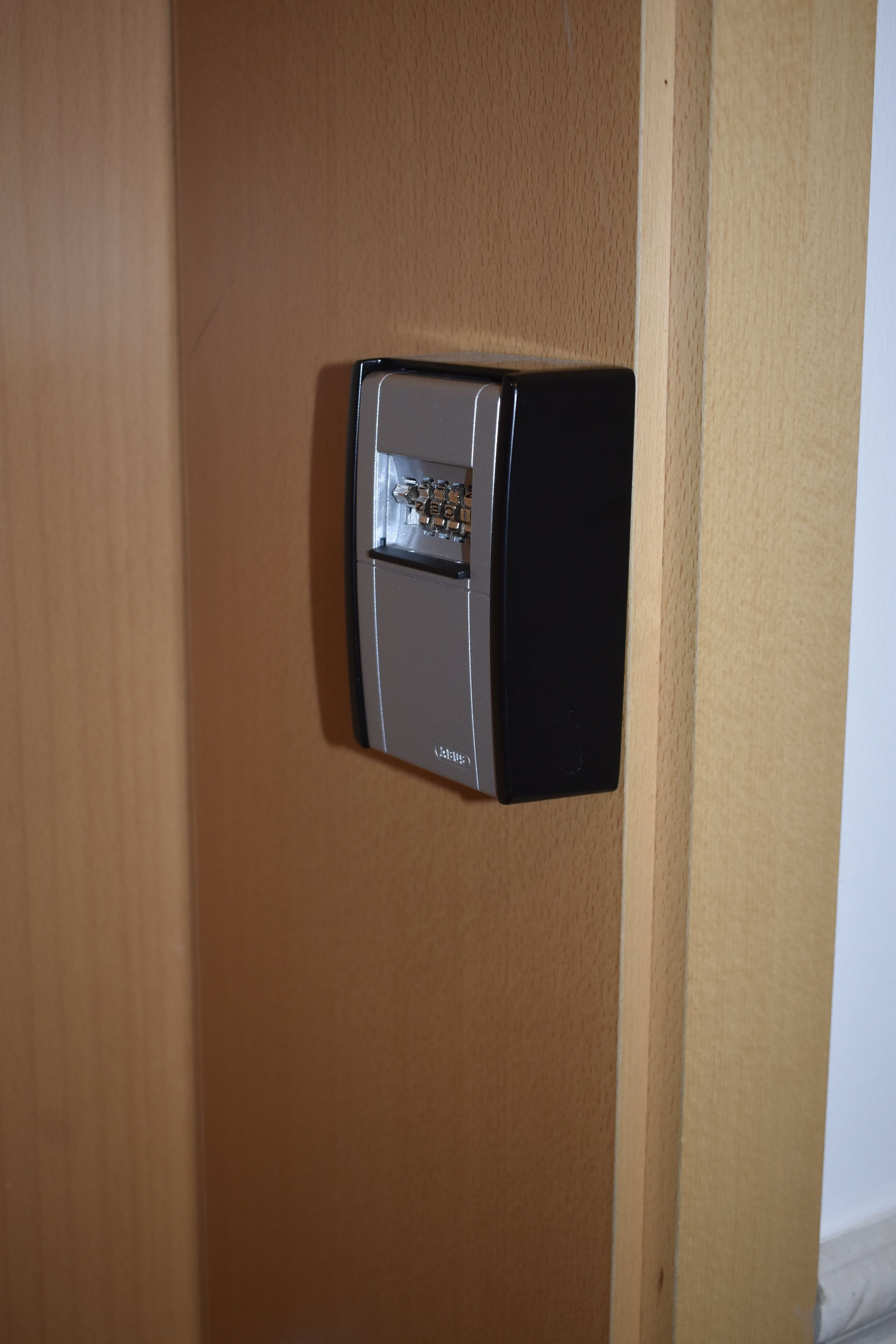 A door with a modern electronic lock system.