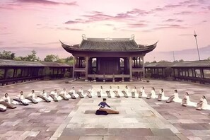 A traditional building with a tiled courtyard, surrounded by a low wall. - GRAND HOUSE NINGBO (Ningbo)