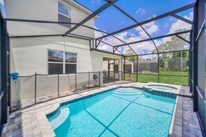 Relax by the pool surrounded by a secure, transparent screen.