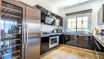 Villa | Private kitchen | Fridge, microwave, oven, stovetop