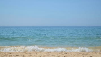 On the beach, sun loungers, beach umbrellas, beach towels