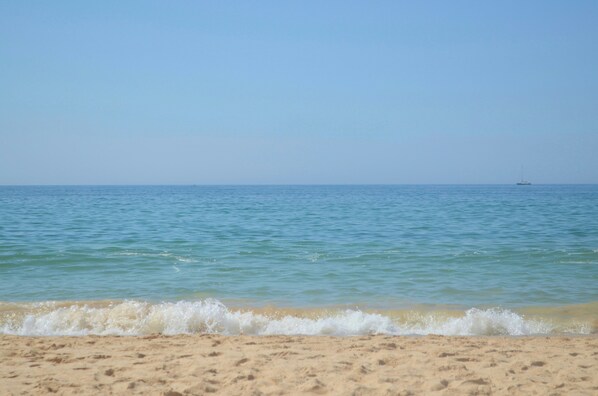 On the beach, sun-loungers, beach umbrellas, beach towels