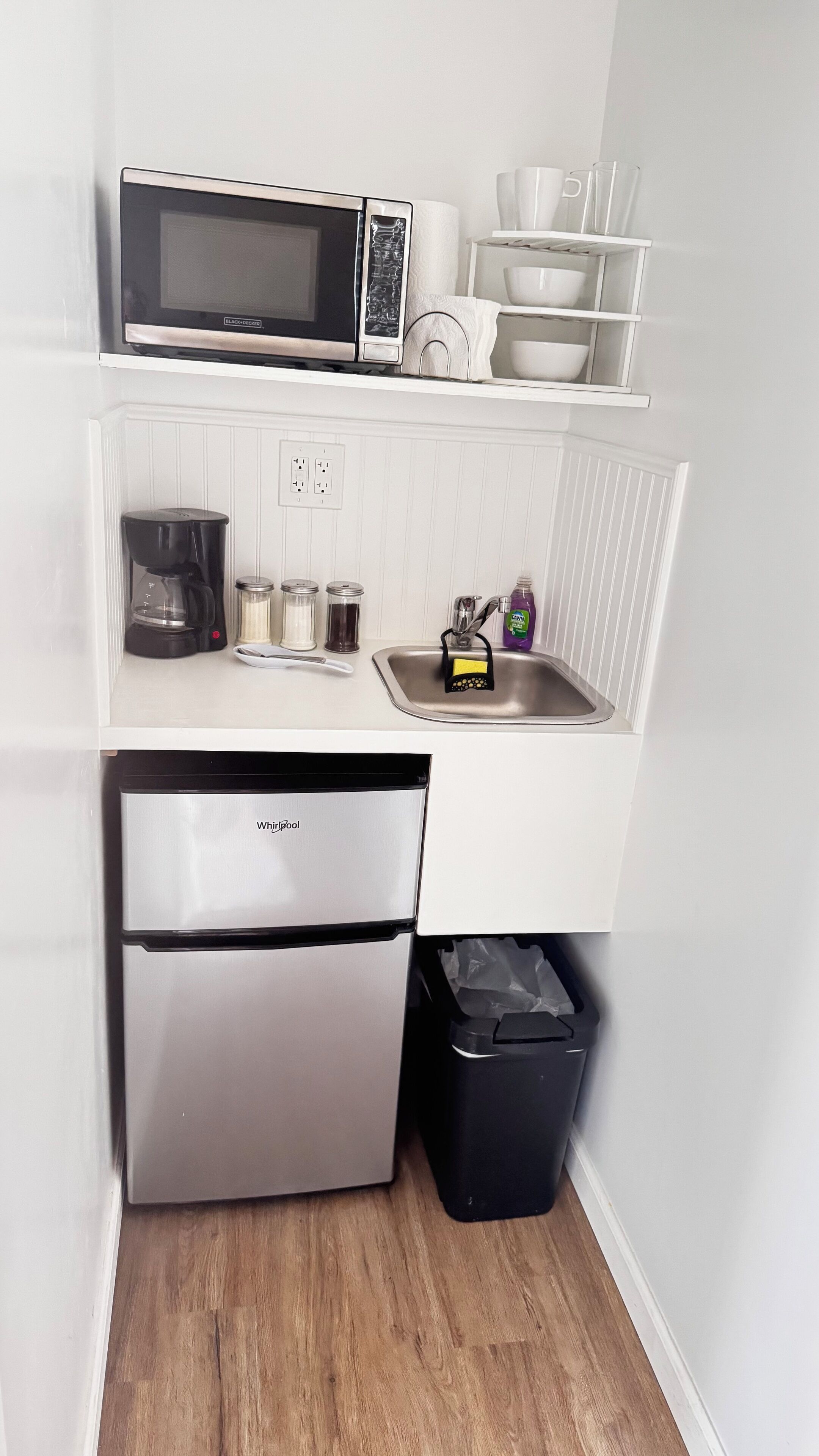 Fridge, microwave, coffee/tea maker, cookware/dishes/utensils