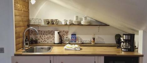 Fridge, microwave, stovetop, coffee/tea maker