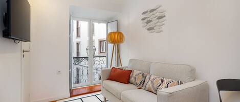 Departamento, 1 habitación | Área de sala de estar | Televisión de pantalla plana