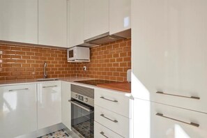Apartment, 1 Bedroom | Private kitchen | Electric kettle, toaster - Modern 1-Bed With Ac & Private Terrace (Lisbon)