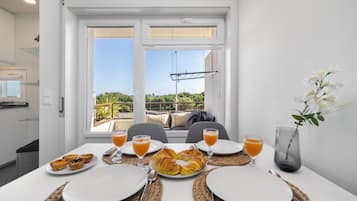 Apartment, 1 Bedroom | Living area | Flat-screen TV