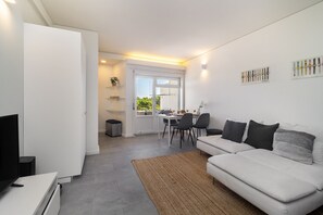 Apartment, 1 Bedroom | Living area | Flat-screen TV