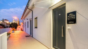 A modern residential building with a sign indicating it is part of the Porto Modern Living Residences. - C314 Riverside View Premium Apartment w/ AC & Terrace (Porto)