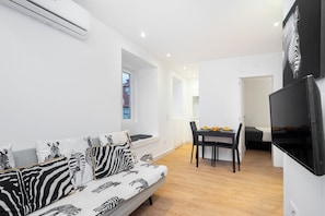 Apartment, 1 Bedroom | Living area | Flat-screen TV