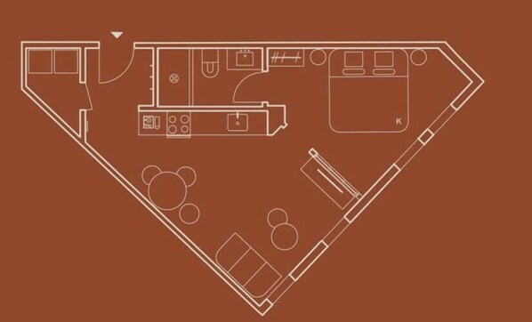 Plano de planta de un hotel con cocina, comedor y un pequeño bar.